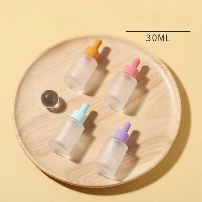 China Business& Wholesale Purchasing 30ml Macaron Essential Oil Glass Bottle Skin Care Serum Flat Transparent Frosted Dropper Bottle for sale