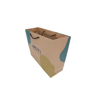 China Hot Sale New Design Recyclable Logo Printed Custom Handle Kraft Paper Bag Packaging Paper Shopping Bags for sale