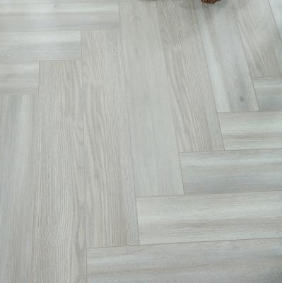 China High Quality Moisture Resistance German Technology HDF ac4 ac5 Herringbone Laminate Chevron Flooring for sale