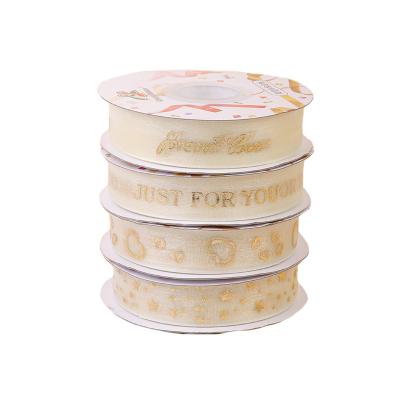 China 2.5cm love and hot tan Gauze Ribbon 2.5cm tan ribbon gold gauze ribbon sale bouquet cake birthday gift wrap star for sale