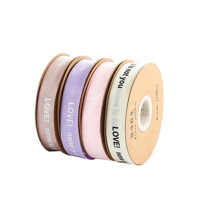 China Creative high-end ribbon love thread ribbon gift of screw net ribbon fashion bouquet wrapping material 2.5cm for sale