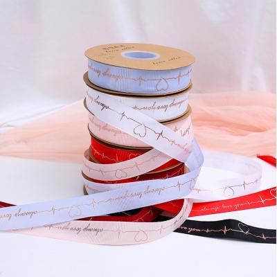 China Creative Heartbeat Gold Ribbon Fashion Bronzing Heart Huasu Ribbon Flowers Gift Baking Wrapping Ribbon for sale