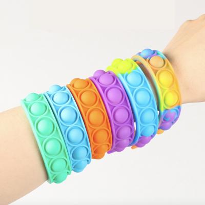 China 2022 New Eco-Friendly Decompression Relaxation Jumping Person Sensory Toy Popit Silicone Push Bubble Squeeze Wristbands for sale