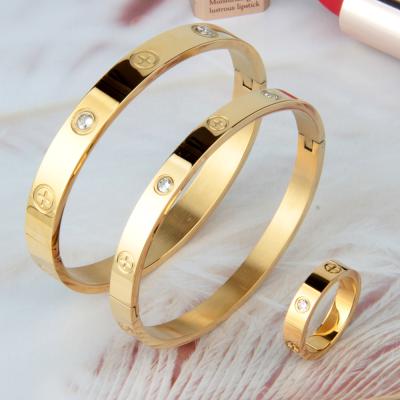 China High Quality Vintage Set Of Titanium Steel Jewelry Accessories Cut Out Diamonds Stainless Steel Gold Ring Cross Inlaid Bracelet for sale