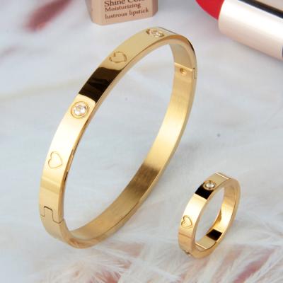 China High Quality Cute Titanium Steel Jewelry Accessories Set Cut Out Diamonds Stainless Steel Gold Ring Heart Shaped Inlaid Bracelet for sale