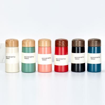 China Custom Logo 150ML Stainless Steel Mini Cute Thermos With Wood Grain Lid Double Wall Pocket Viable Mug for sale