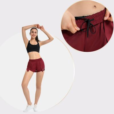 China Breathable Women Summer Loose Drawstring Tennis Sports Fitness Outdoor Quick Dry Shorts With Pockets for sale