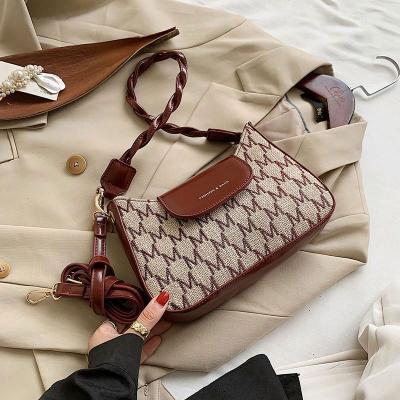 China 2021 Popular Braided Rope Straw Women's Bag High Quality Bag Armpit Fashion Printed Women's Handbags Shoulder Handbags for sale