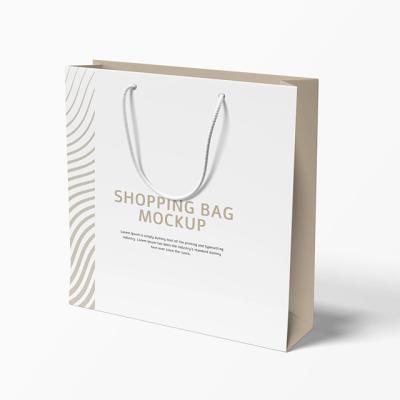 China Wholesale Customized Luxury White Recycled Materials Size Logo Printed Ribbon Handle Paper Shopping Bag for sale