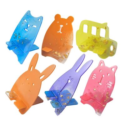 Chine Les moules de silicone pour la résine colorée mobile de modèle de bande dessinée du support 9pcs moule les bijoux époxydes à vendre