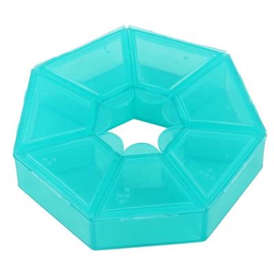 China Polygon Shape Eco-friendly Weekly Pill Organizer Plastic Portable 7 Day Weekly Pill Dispenser for sale