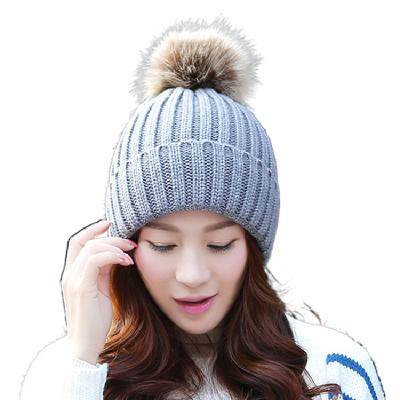 China COMMON Hot Sale Winter Knitted Artificial Plush Ball Beanie Winter Hats for sale