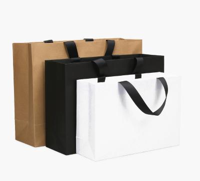 China Brand Biodegradable Custom Logo Recyclable Gift Boutique Recyclable Luxury Shopping Clothes Handle Kraft Paper Bags With Your Own Logo for sale