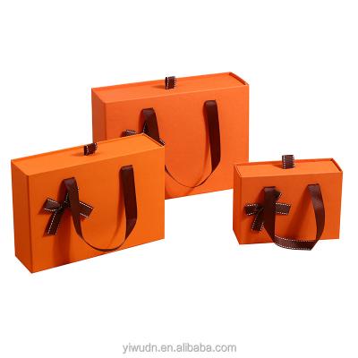 China Recyclable Large Size Sliding Orange Gift Box With Logo Perfume And Skincare Product Custom Luxury Gift Packaging Box With Bow for sale