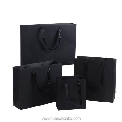 China Handmade Luxury Black Print Customize Logo Boutique Paper Bag For Apparel And Cosmetics for sale