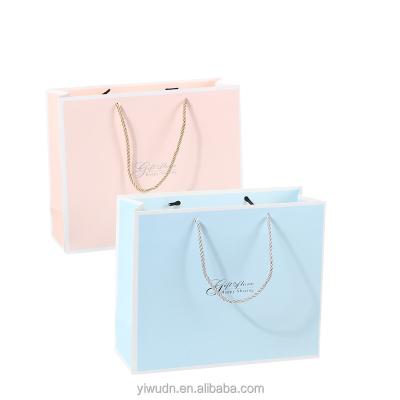 China Handmade Eco-Friendly Flat Handle Printed Logo Luxury Paper Bag For Garment Packaging for sale