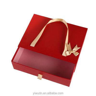 China Recyclable fashion design attractive wedding bridesmaid gift box for masks and cosmetics package box with ribbon handle for sale