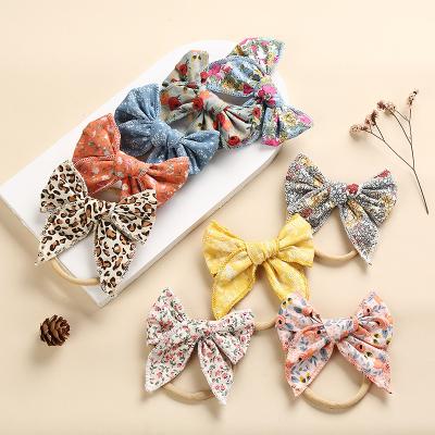 China Hot Selling New Spring Style Kids Fabric Flower Pattern Big Bow Hair Decoration Elastic Hair Band Hair Rope For Kids Ponytail for sale