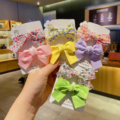 China Decorate New Hot Sale Spring Style 2pcs/set Kids Cloth Flower Bowknot Hair Clips Set For Girls Hair Accessories for sale