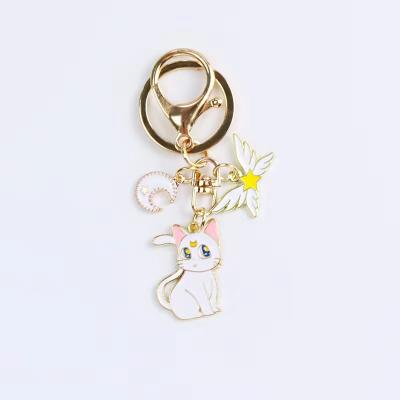 China Cute Wings Cat Fasion Angel Star Moon Metal Car Key Chain Pendant Bag With Accessories for sale