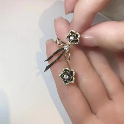 China Fashionable Silver Diamond Flower Bow S925 Needle Dangle Earrings Charm Zircon Earrings for sale