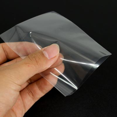 China Safety Clear Magnum Copper Sleeve 65x100mm Board Game Card Sleeves for sale