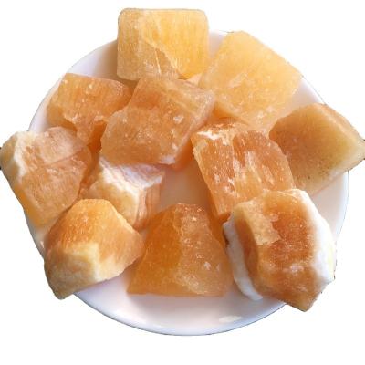 China Wholesale Natural High Quality Yellow SPAR Stone Calcite Healing China Rose Quartz Crystal Raw Stone for sale