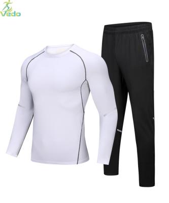 China Wholesale Custom Made Breathable Sportswear Polyester Men 2 Pieces Long Sleeve Shirt And Pants Compression Tights for sale