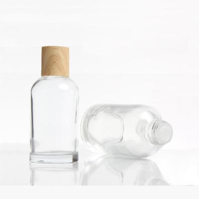 China LOW MOQ 40ml 100ml 120ml high quality transparent glass bottle with cap for essential water for sale