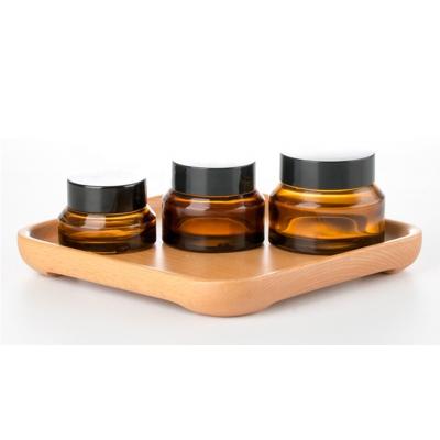 China LOW MOQ 50g Cosmetic Cheap Empty Narrow Mouth Amber Glass Jar For Skincare Cream for sale