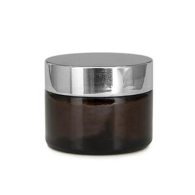 China 20g 30g 50g 100g Cosmetic Amber Glass Cosmetic Cream Jar With Black Lid for sale