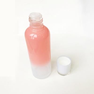 China 120ML Cosmetic Luxury Gradient Rose Cap Glass Inner Bottles For Essential Water for sale