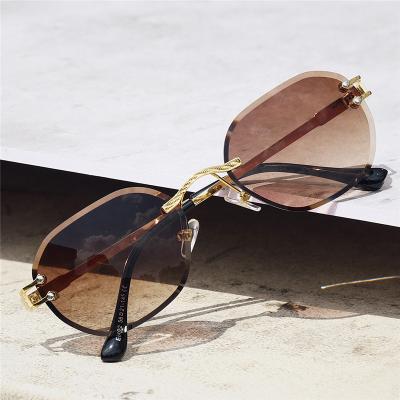 China Fashion sunglasses 2022 rectangle rimless sunglasses for men's small round women's sunglasses metal hot sale rimless sunglasses for sale