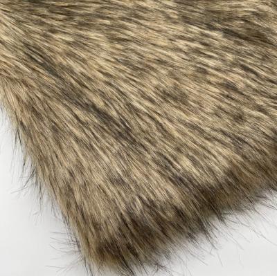 China Hot Auto Upholstery in Amazon Faux Raccoon Fur Fabric Trick Dyed Artificial Raccoon Wolf Fur Hair Faux Faux Fur Fabric for sale