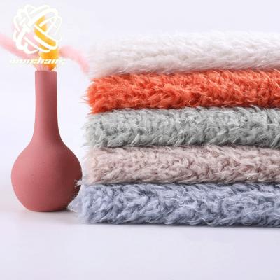 China Auto Upholstery Fabric Supplier 100% Polyester For Shoes Faux Teddy Fur Llama Fur Knit Fabric Soft Curly Fur for sale