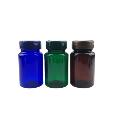 China Pill 80cc 100cc PET Amber Blue Pharmaceutical Plastic Pill Bottles Round Metal Cap Bottle for sale