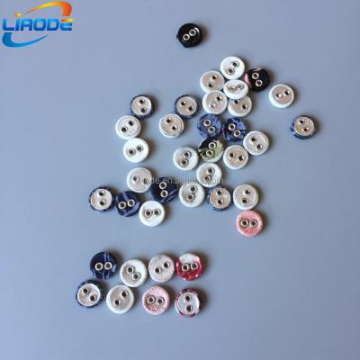 China Two Holes Dry Cleaning Colorful Silver Eyelet Cloth Covered Button For Clothes for sale