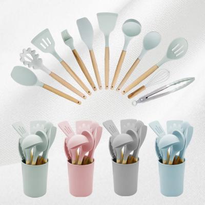 China Environmentally Friendly Kitchenware Accessories Tool 11Pcs Silicone Cookware Cookware Set With Wooden Handle for sale