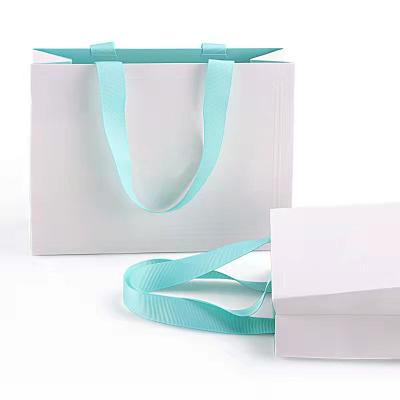 China Recyclable High Quality Luxury custom shopping bags logo printed boutique shopping bags with ribbon for sale