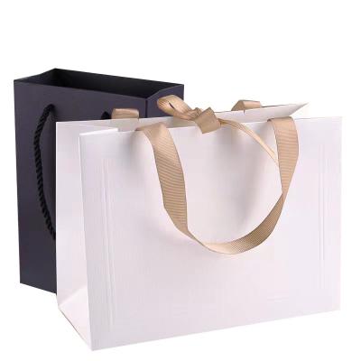 China Recyclable New High Quality Custom Craft Printing Paper Bags With Your Own Logo Paper Gift Packaging Bag for sale