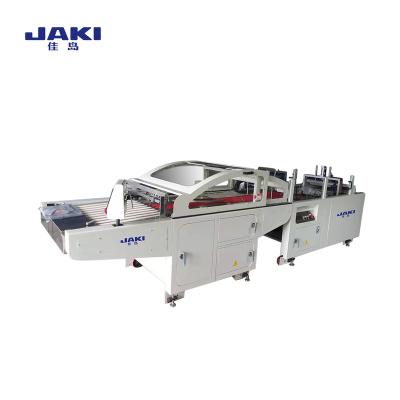 China Garment Shops JAKI Full Automatic Cheap Price Garment Folding Machine Common With Packing Machine for sale