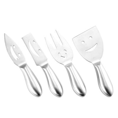 China Sharp Face Pattern Stainless Steel Cheese Spatula Cheese Fork Cheese Viable Smiling Knife With Hollow Handle for sale