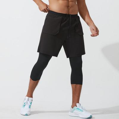 China Anti-Wrinkle 2 In 1 Gym Polyester Compression Pants Double Layer Sports Basketball Shorts Men With Zipper Pocket for sale