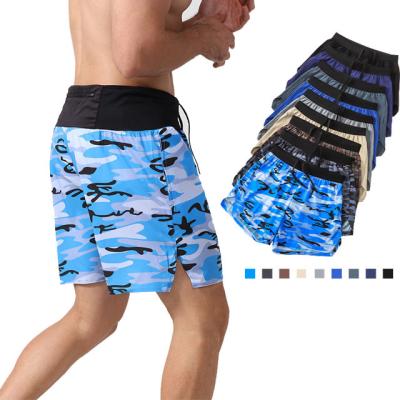 China Custom Anti-Wrinkle Camouflage Print Summer Workout Shorts Loose 5 Inch Polyester Beach Abbreviations Mens Quarter Pants for sale