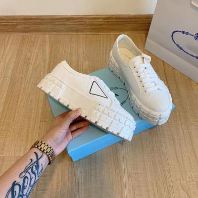 China Cushioning Plada Brand All Triangle Logo Simple Casual Platform Double Color Wheel Sneakers For Women for sale