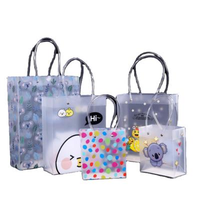 China New Design Non-toxic Fashion PVC PP Plastic Transparent Handle Packaging Gift Bag Frosted Shopping Packaging Bag for sale