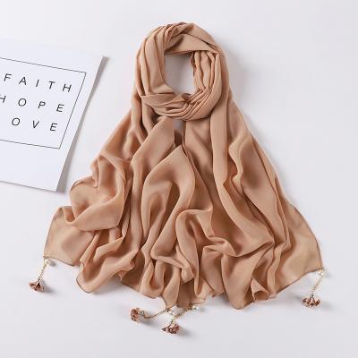 China Plain With Tassel Color Chiffon Scarves 70*175cm Malaysian Casual Solid Simple Pearl Chiffon Hijab Scarf With Flower Tassel for sale