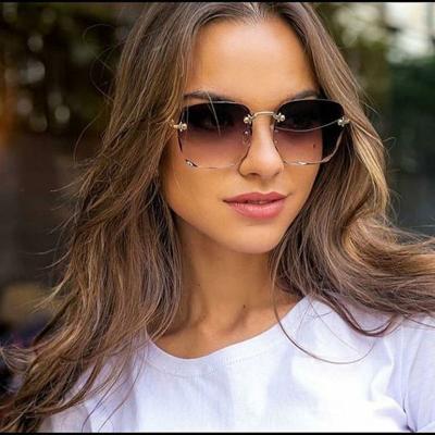 China Foldable Sunglasses 2021 Trends Oversized Big Square Street Exposure Rimless Sunglasses For Women for sale