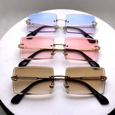 China Fashion Sunglasses 2021 Hot Sale Customized Color Square Fashion Rimless Sunglasses Retro For Women Famous Design for sale