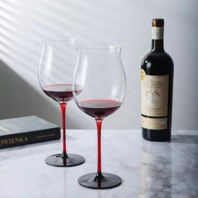 China Sustainable Unique 880Ml Lead Free Clear Crystal Burgundy Wine Glasses Goblet Red Stem Black Base Wine Glass For Home Party for sale